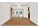 Dining room with hardwood floors and access to the backyard at 6288 Airmont Dr, Spring Hill, FL 34606