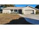 Brick ranch house with attached garage and well-maintained lawn at 6288 Airmont Dr, Spring Hill, FL 34606