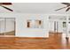 Open living area with hardwood floors and kitchen pass-through at 6288 Airmont Dr, Spring Hill, FL 34606