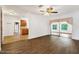 Bright living room features wood-look floors and sliding glass doors leading to the outdoors at 6288 Airmont Dr, Spring Hill, FL 34606