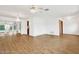 Spacious living area with hardwood floors and ceiling fan at 6288 Airmont Dr, Spring Hill, FL 34606