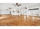 Spacious living area with hardwood floors and ceiling fans at 6288 Airmont Dr, Spring Hill, FL 34606