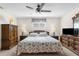 Relaxing bedroom with a king-size bed, wooden furniture, and a TV at 6409 Wedgewood Dr, Spring Hill, FL 34606
