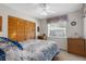 Bedroom with carpeted floors, ceiling fan, and wooden furniture at 6409 Wedgewood Dr, Spring Hill, FL 34606