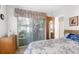 View of a bedroom with carpeted floors, ceiling fan, and wooden furniture at 6409 Wedgewood Dr, Spring Hill, FL 34606