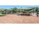 Outdoor bocce ball courts with shaded seating areas at 6409 Wedgewood Dr, Spring Hill, FL 34606
