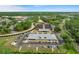 Aerial view of community clubhouse and tennis courts at 6409 Wedgewood Dr, Spring Hill, FL 34606