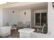 Covered front porch with seating, stone accents, and double doors at 6409 Wedgewood Dr, Spring Hill, FL 34606