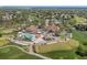 Golf course with clubhouse, pool, tennis courts, and parking lot at 6409 Wedgewood Dr, Spring Hill, FL 34606