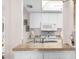 View of kitchen counters, sink, white appliances, and decorative accents at 6409 Wedgewood Dr, Spring Hill, FL 34606