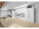 Kitchen with white appliances, light countertops, and breakfast bar seating at 6409 Wedgewood Dr, Spring Hill, FL 34606