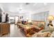 Living room featuring wicker furniture, large windows, and ample space at 6409 Wedgewood Dr, Spring Hill, FL 34606