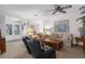 Living room with two sofas, ceiling fan, and entryway with glass doors at 6409 Wedgewood Dr, Spring Hill, FL 34606