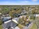 Aerial view of a neighborhood with houses, trees, and streets at 6409 Wedgewood Dr, Spring Hill, FL 34606