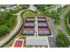 Aerial view of tennis and pickleball courts, basketball court, and clubhouse at 6409 Wedgewood Dr, Spring Hill, FL 34606