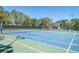 Tennis and pickleball courts with blue and green surfaces at 6409 Wedgewood Dr, Spring Hill, FL 34606