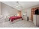 Bedroom with a king-size bed, matching nightstands, and a dresser at 714 Charlotte Ave, Tarpon Springs, FL 34689