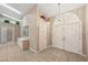 Foyer with tiled flooring, double doors, skylights, and storage at 714 Charlotte Ave, Tarpon Springs, FL 34689