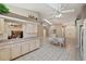 Spacious kitchen featuring white cabinetry, tile flooring, and ample counter space at 714 Charlotte Ave, Tarpon Springs, FL 34689