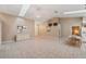 Open-concept living and dining area adjacent to the kitchen, with tiled flooring at 714 Charlotte Ave, Tarpon Springs, FL 34689