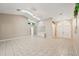 Living room with tiled flooring, vaulted ceiling, skylights, and access to other rooms at 714 Charlotte Ave, Tarpon Springs, FL 34689