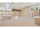 Open concept living area with vaulted ceiling, skylights, kitchen, and dining area at 714 Charlotte Ave, Tarpon Springs, FL 34689