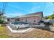 Above-ground pool with a surrounding patio and lush green lawn at 714 Charlotte Ave, Tarpon Springs, FL 34689