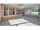 Screened porch with a view of the pool and backyard at 714 Charlotte Ave, Tarpon Springs, FL 34689