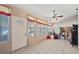 Sunroom with tile floors and several large windows at 714 Charlotte Ave, Tarpon Springs, FL 34689