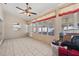 Bright sunroom with tiled floors and numerous large windows at 714 Charlotte Ave, Tarpon Springs, FL 34689
