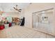 Spacious sunroom with tile flooring and an open view to another room at 714 Charlotte Ave, Tarpon Springs, FL 34689