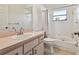 Simple bathroom with shower/tub combo, single vanity, and tile flooring at 7717 Foxbear Ct, New Port Richey, FL 34655