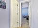 View of a bedroom through open doors from the hallway at 7717 Foxbear Ct, New Port Richey, FL 34655