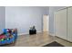 bedroom with blue walls, a bed, and closet doors at 7717 Foxbear Ct, New Port Richey, FL 34655