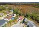Elevated perspective of the home nestled in a residential community with solar panels at 7717 Foxbear Ct, New Port Richey, FL 34655