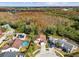 Birds-eye view of home, surrounding properties, and nearby wooded areas at 7717 Foxbear Ct, New Port Richey, FL 34655