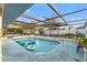 Inviting screened pool with ample space for lounging at 10334 Maderia St, Spring Hill, FL 34608