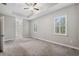 Bright bedroom with plantation shutters and ceiling fan at 10451 Gypsy Ave, Weeki Wachee, FL 34613