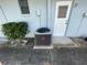 Exterior view of central AC unit and exterior door at 11556 Linden Dr, Spring Hill, FL 34608