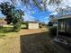 Backyard view showing a shed and a partially visible house at 11556 Linden Dr, Spring Hill, FL 34608