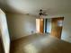 Bedroom with wood closet doors and carpet at 11556 Linden Dr, Spring Hill, FL 34608