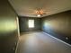 Bedroom with dark walls and ceiling fan at 11556 Linden Dr, Spring Hill, FL 34608