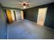Spacious bedroom with carpeted floor and ceiling fan at 11556 Linden Dr, Spring Hill, FL 34608