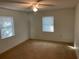 Spacious bedroom with carpet flooring and ceiling fan at 11556 Linden Dr, Spring Hill, FL 34608