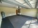 Spacious garage with grey carpet flooring at 11556 Linden Dr, Spring Hill, FL 34608