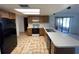 Kitchen with black appliances and wood cabinets at 11556 Linden Dr, Spring Hill, FL 34608