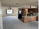Kitchen features wood cabinets and a breakfast bar at 11556 Linden Dr, Spring Hill, FL 34608