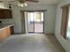 Spacious living room with sliding glass doors to patio at 11556 Linden Dr, Spring Hill, FL 34608