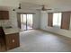 Spacious living room with sliding glass doors to patio at 11556 Linden Dr, Spring Hill, FL 34608