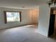 Bright living room with carpet flooring and large window at 11556 Linden Dr, Spring Hill, FL 34608